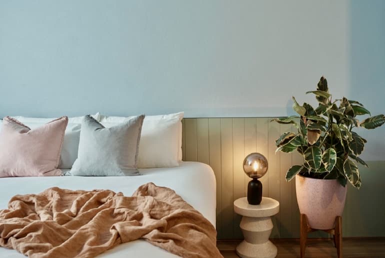 Kyah Boutique Hotel room featuring relaxing soft pastel interiors