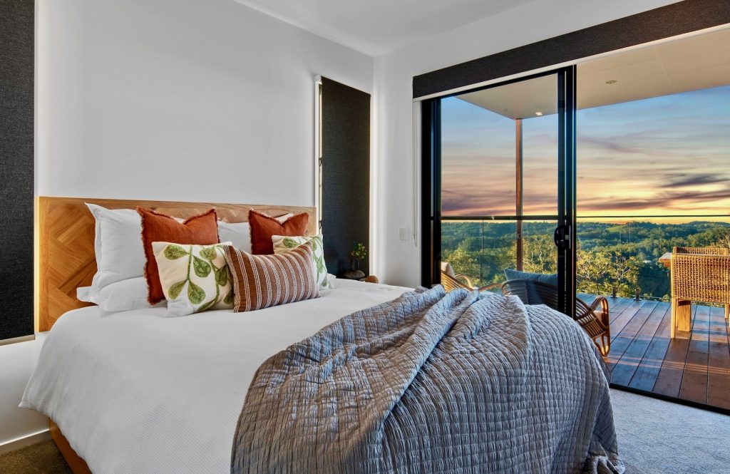 Cosy bedroom and furnished balcony with hinterland views at The Ridge at Maleny