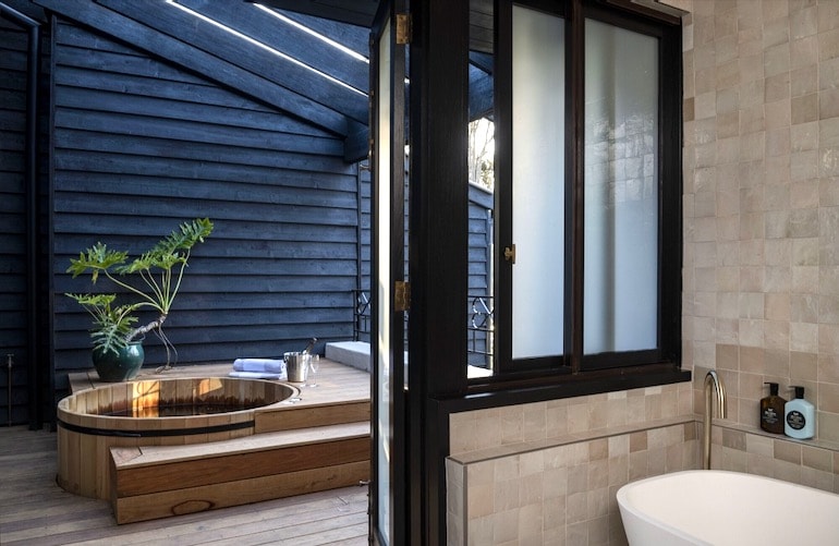 Tower Lodge semi-open wood tub and indoor bath tub