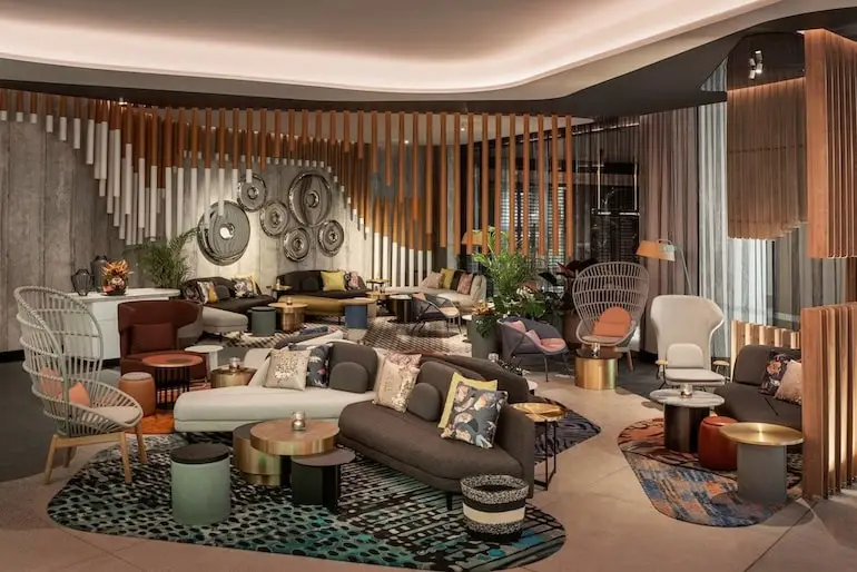 W Brisbane's eclectic interior design featuring a motley of couches and accent tables